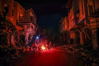 In the Huzaa district of Khan Yunis, Gaza, Palestinians are contending with harsh cold weather conditions, facing limited resources and challenging circumstances.