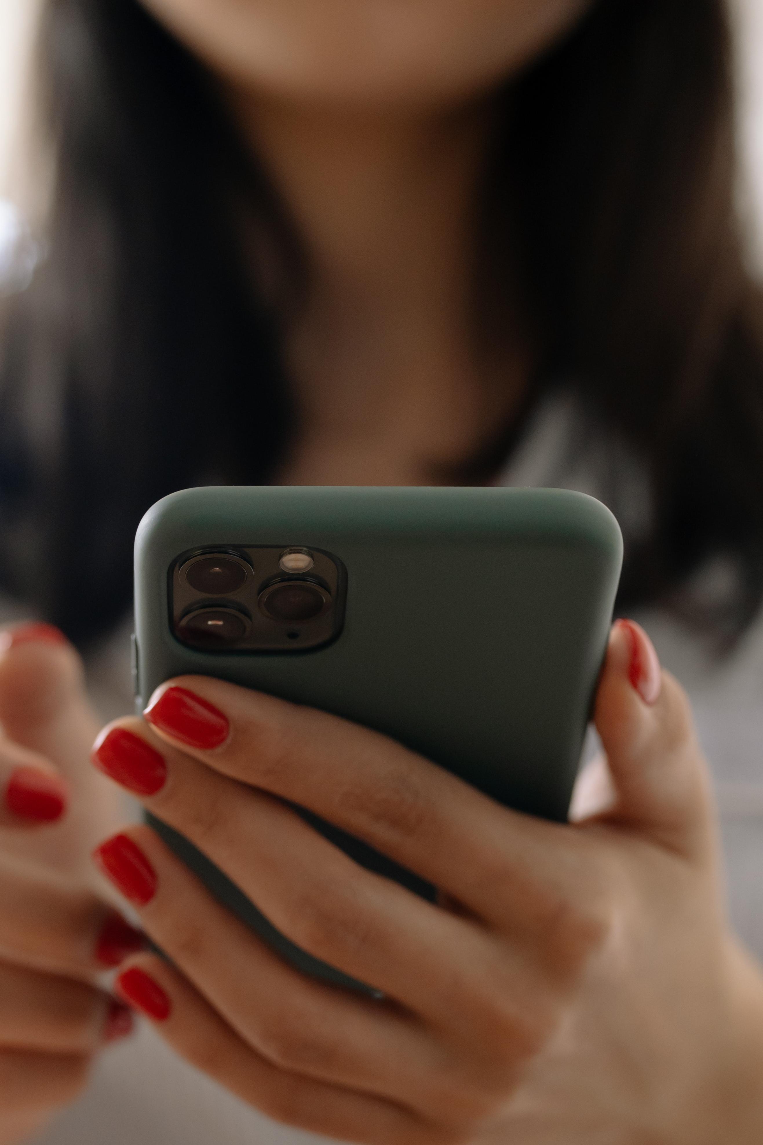 A woman holding her phone