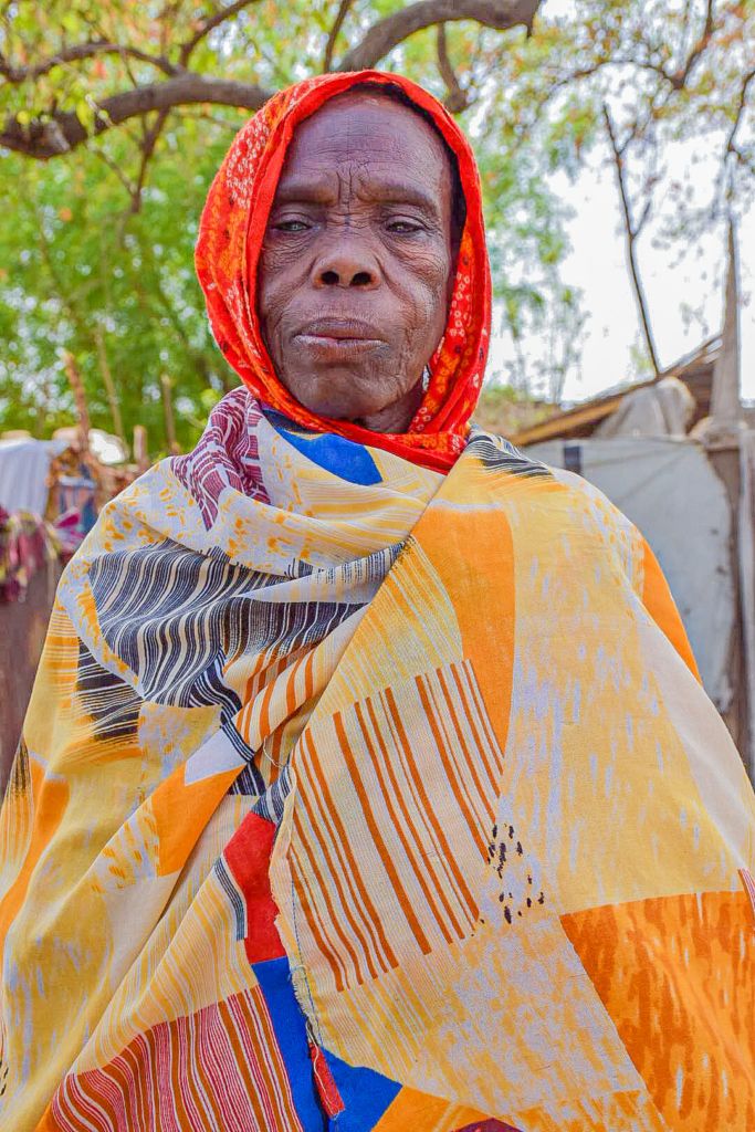 Amina Musa, stands and looks at the camera