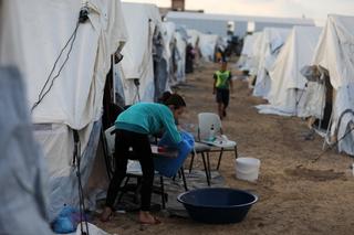 Tents for Palestinians seeking refuge are set up on the grounds of a United Nations Relief and Works Agency for Palestine Refugees (UNRWA) centre in Khan Yunis