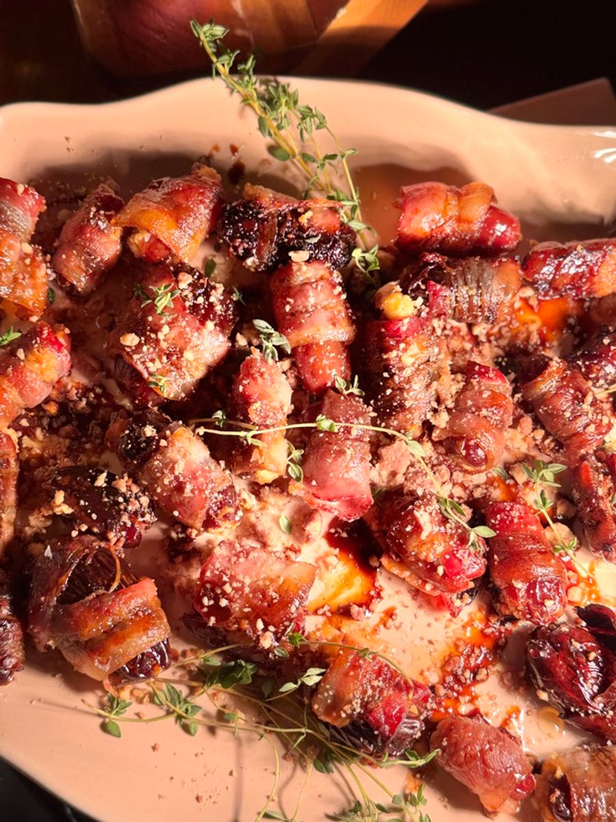 Bacon wrapped dates finished with fresh thyme