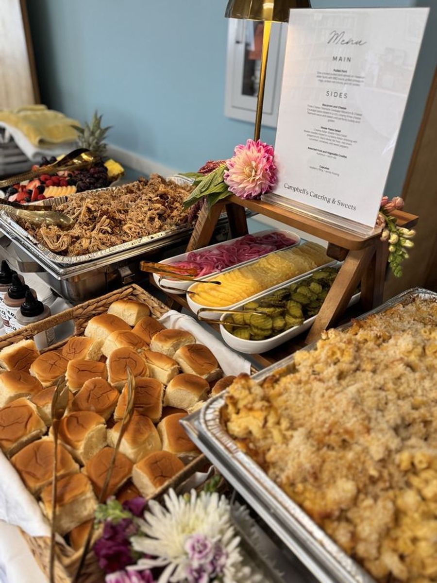 Buffet line laid out with hot trays and garnish