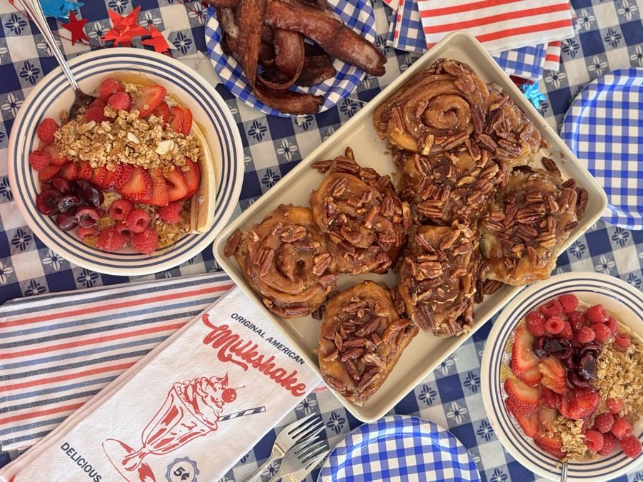Breakfast spread with cinnamon rolls and fresh fruit
