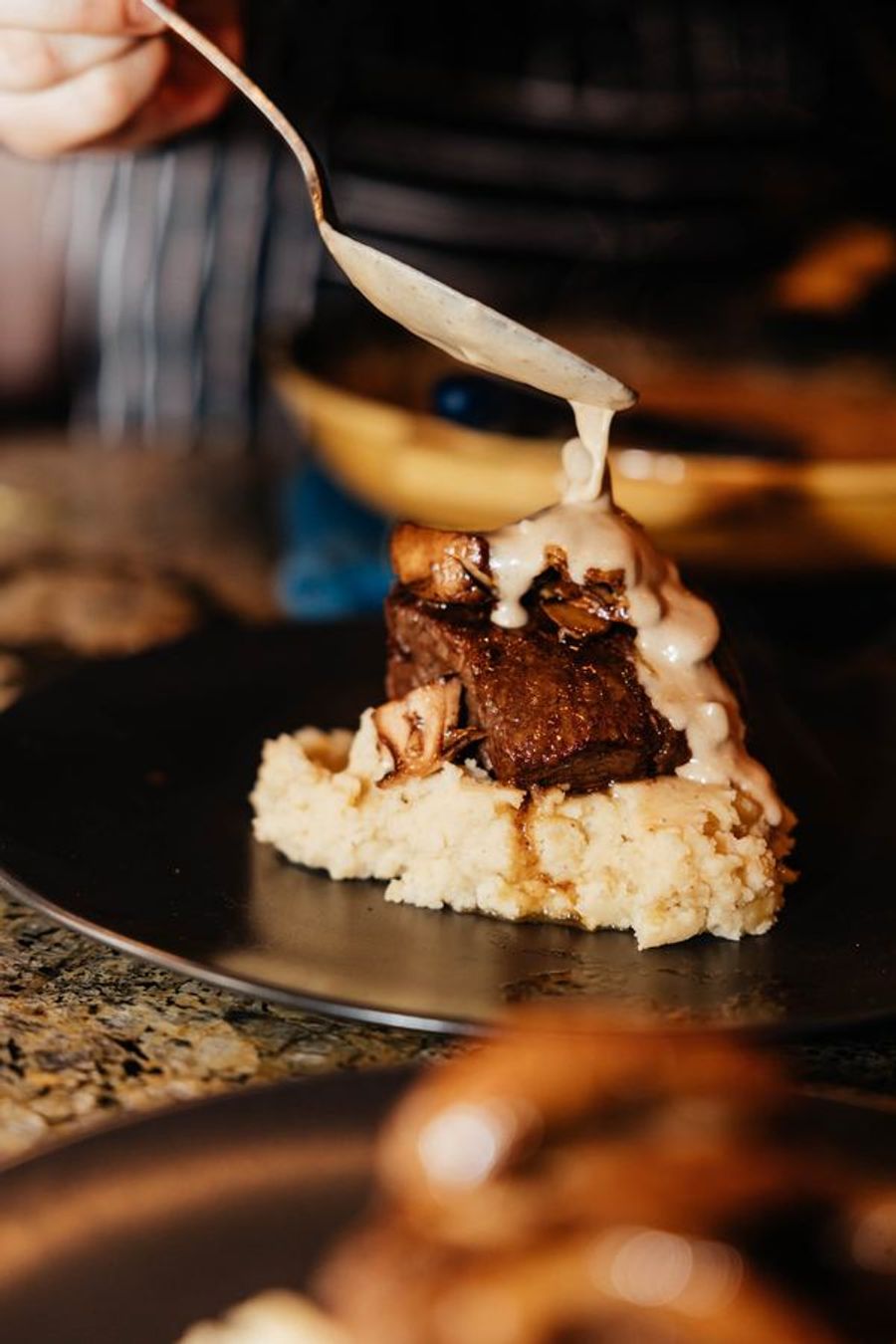 Sauce poured over a filet just before serving
