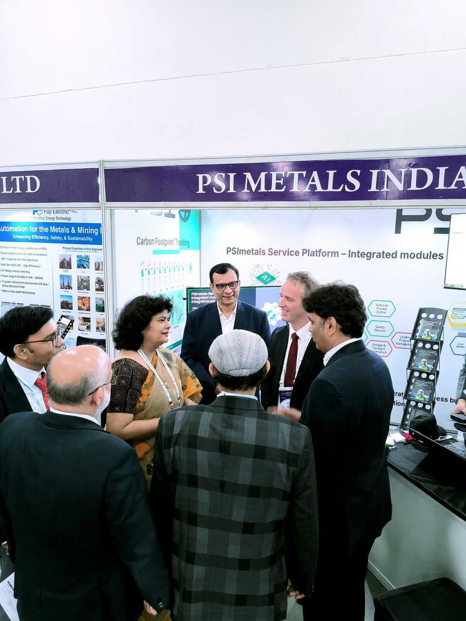 A crowd gathers at the PSImetals stand