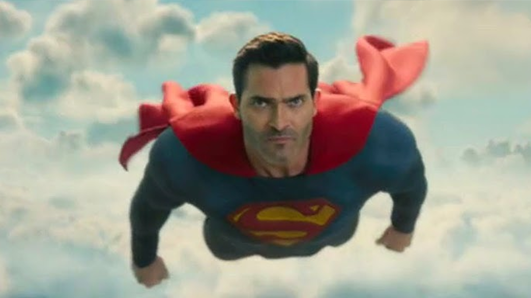 Superman is flying with a determined expression on his face.