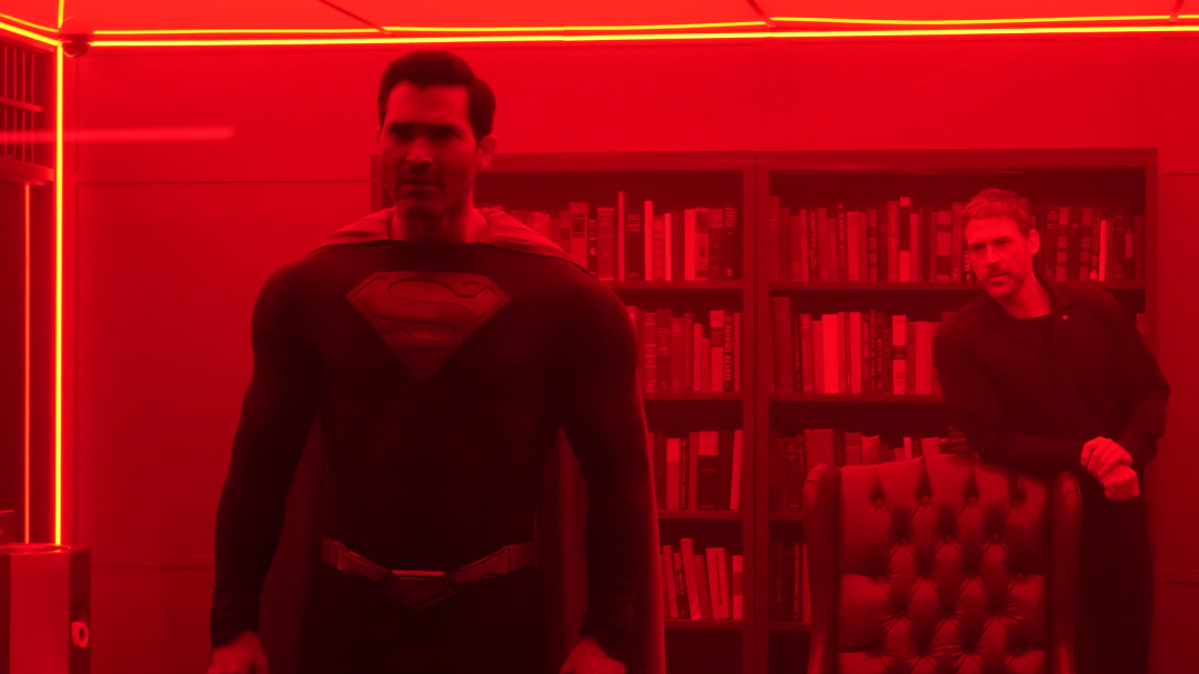 Superman and Tal in a red sun prison cell.
