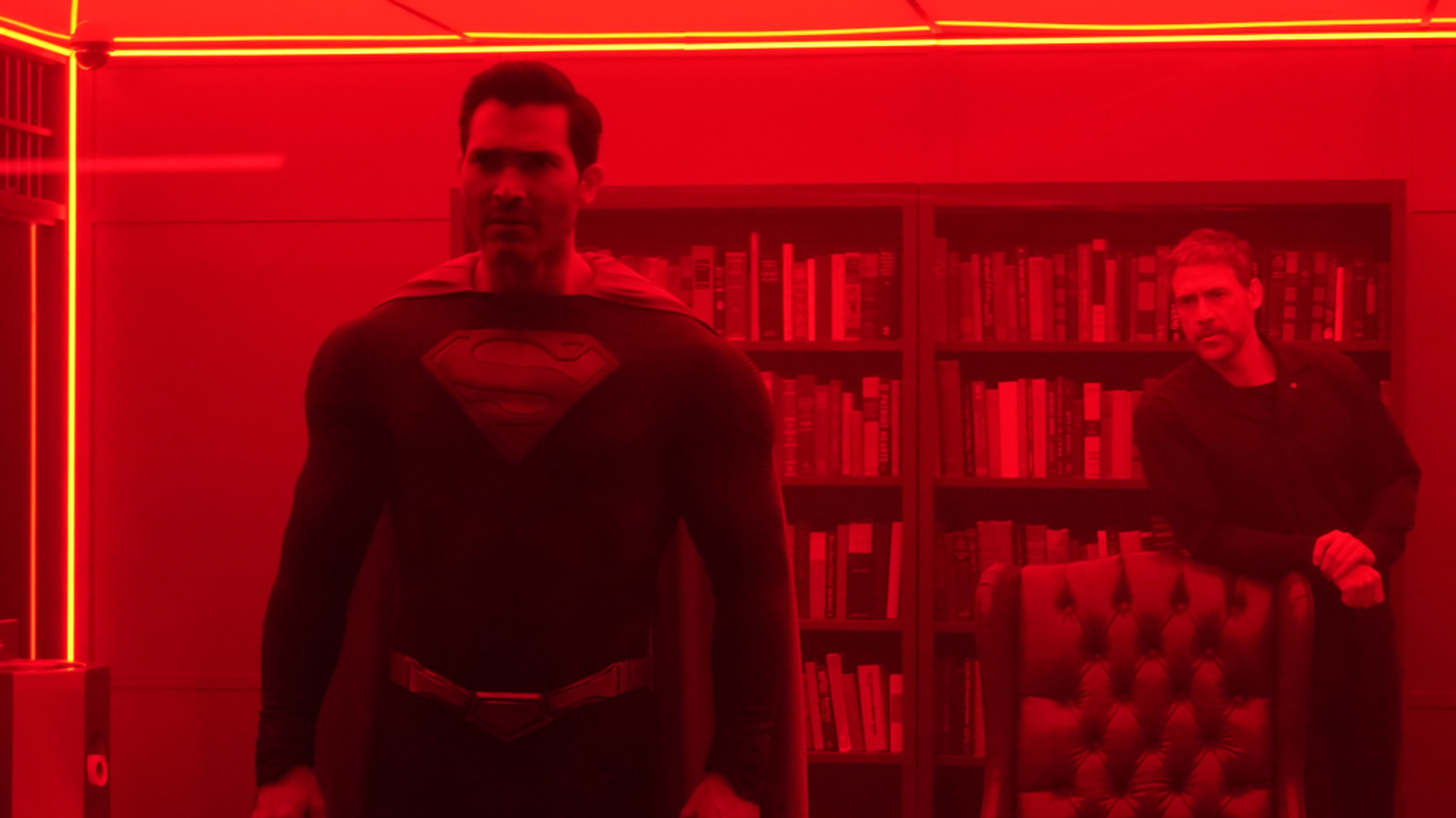 Superman and Tal in a red sun prison cell.