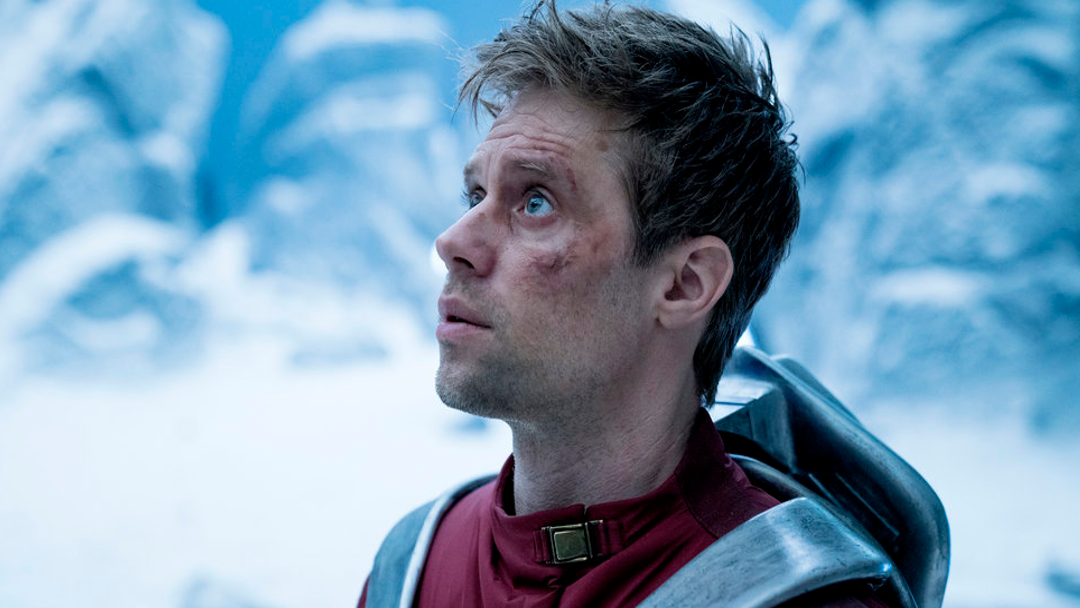 Adam Strange wearing a jet pack.