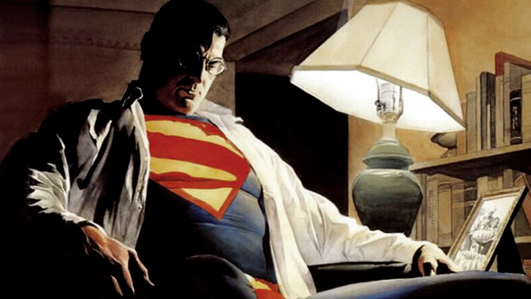 Superman sitting alone in an armchair.