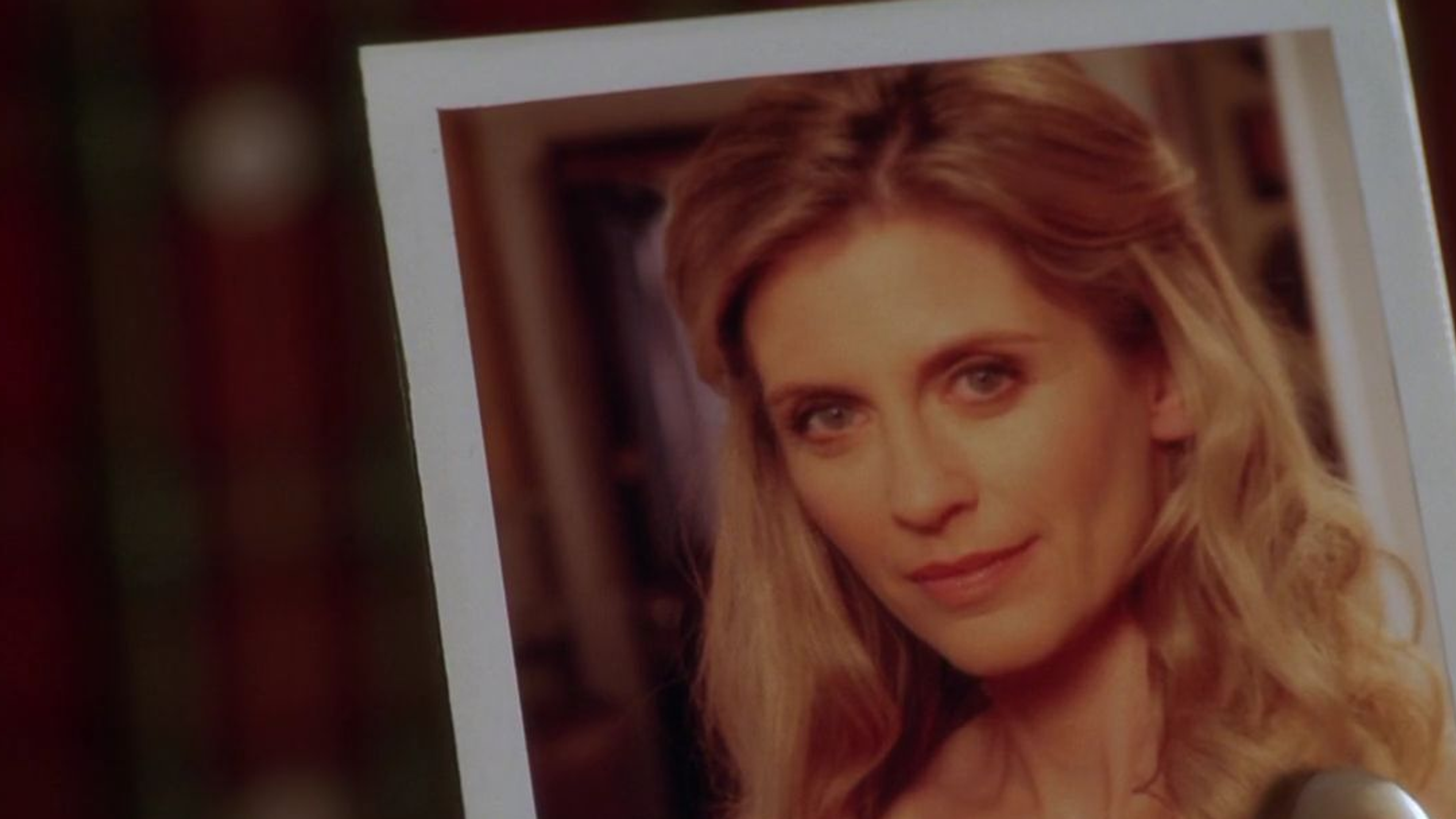 A polaroid photo of a blonde woman.