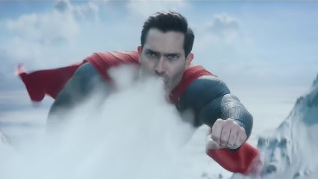 Superman using his super breath to stop an avalanche.