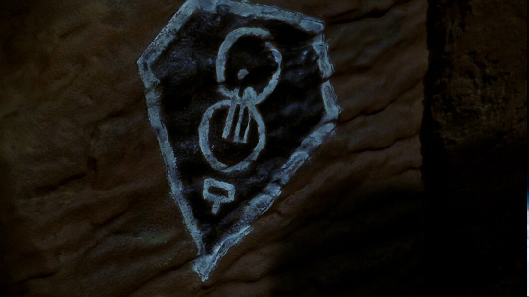 A kryptonian symbol drawn on a cave wall.