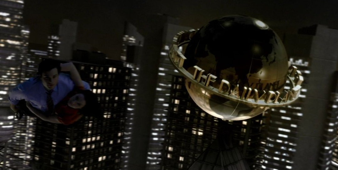 Clark and Lois flying past the Daily Planet in a virtual world.