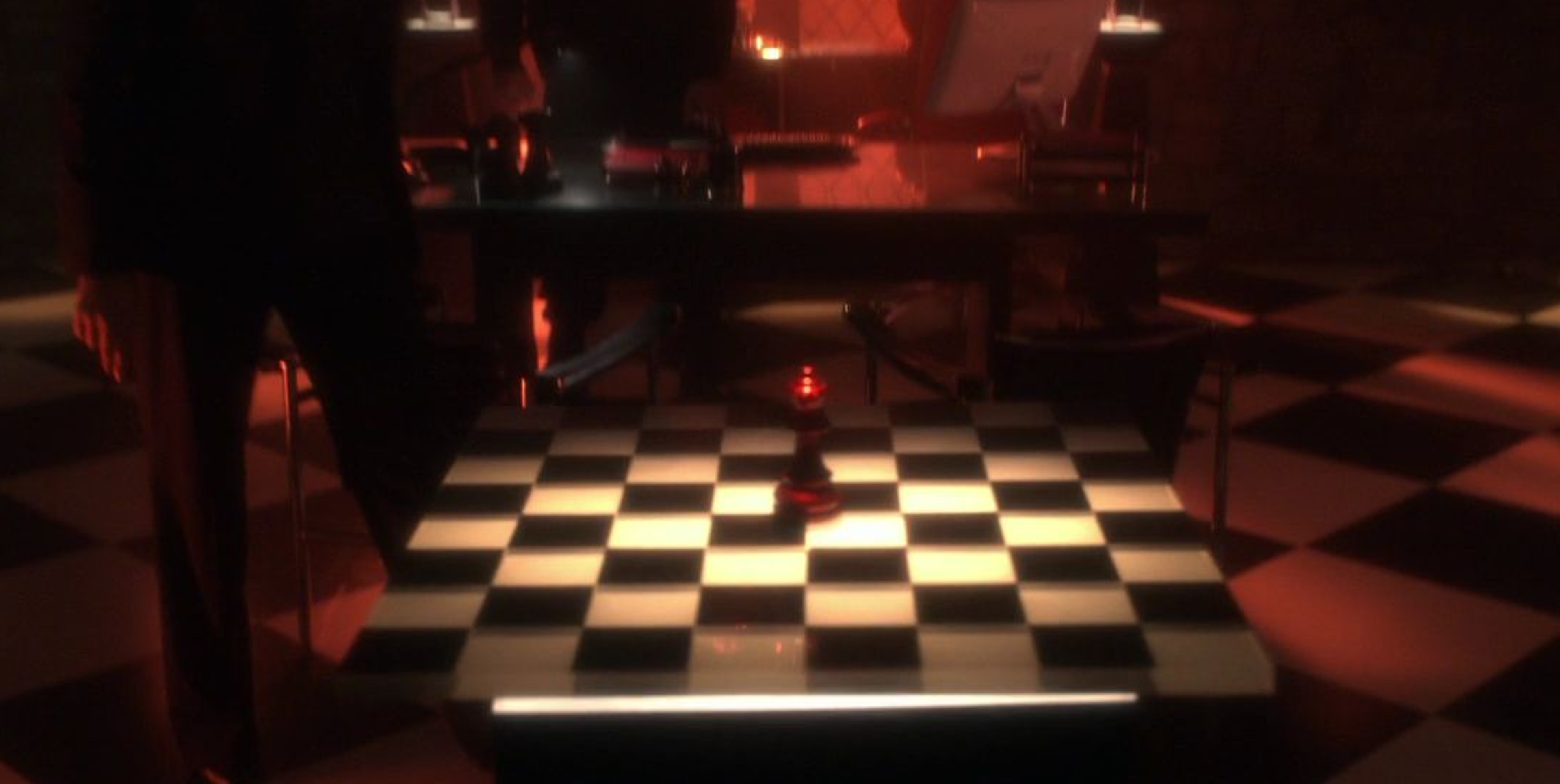 A red Queen chess piece.