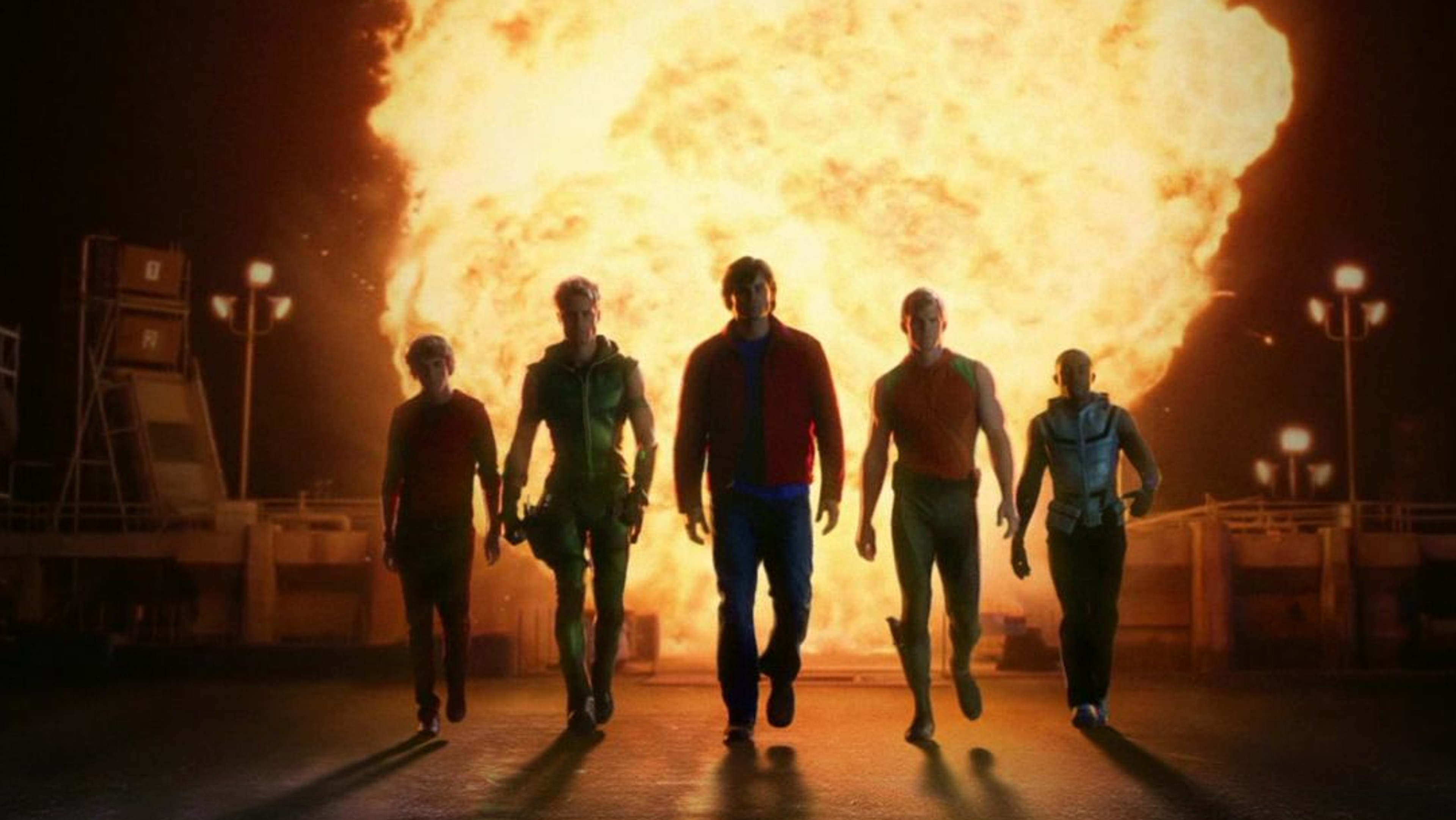 The Justice League walking away from an explosion.
