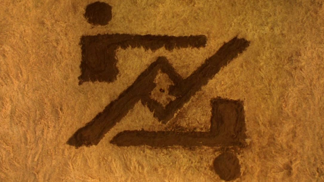 Zod's mark burnt into a cornfield.