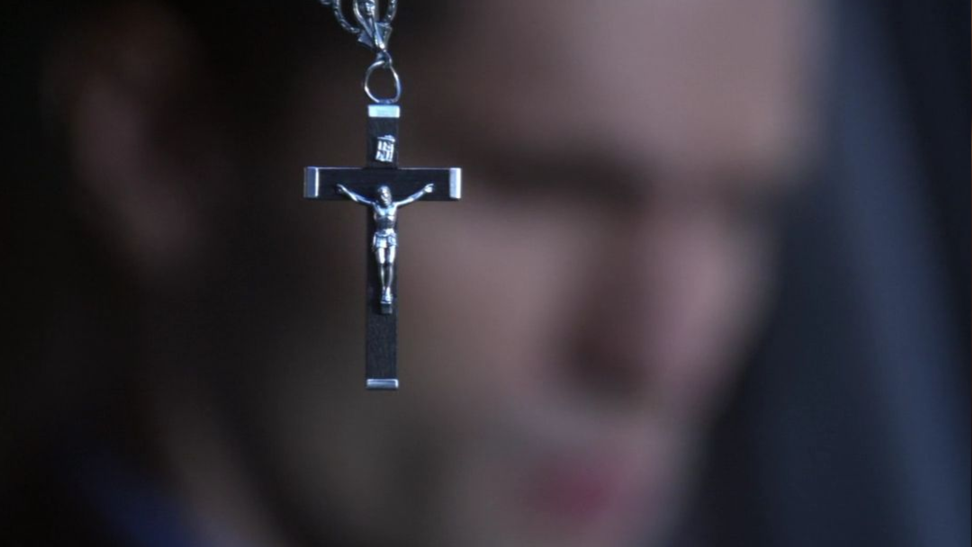 A crucifix hangs in the foreground of Davis Bloome's rig. 