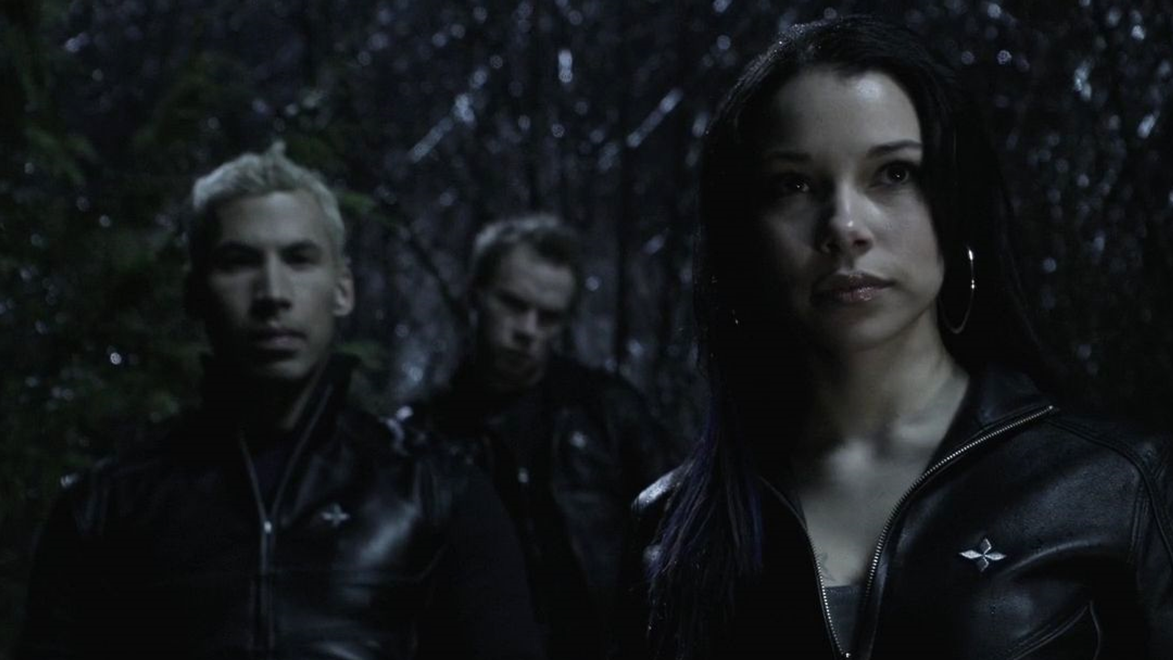 A group of criminals in black leather uniforms.