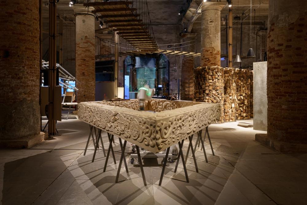 Bjarke Ingels Group’s exhibition ‘Ancient Future’, showing a robot carving timber beams