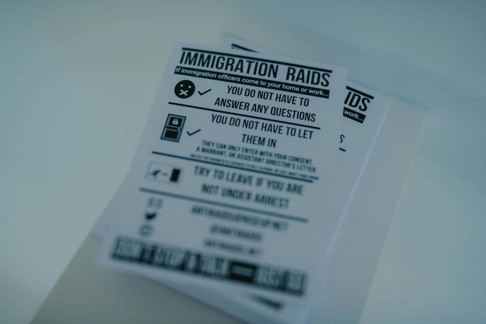 An image of an immigration raid awareness poster