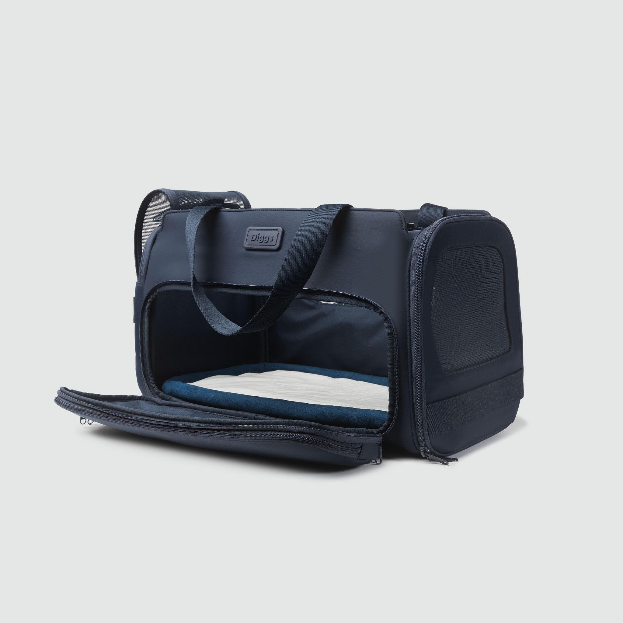 A blue Passenger pet carrier bag with a zippered compartment