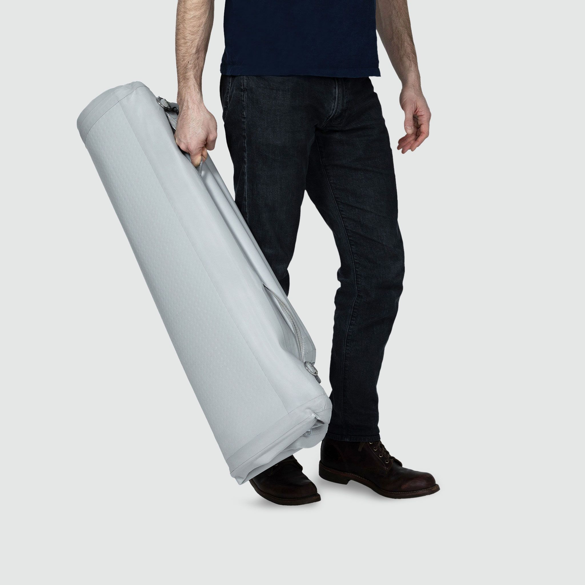A man is carrying a deflated Enventur