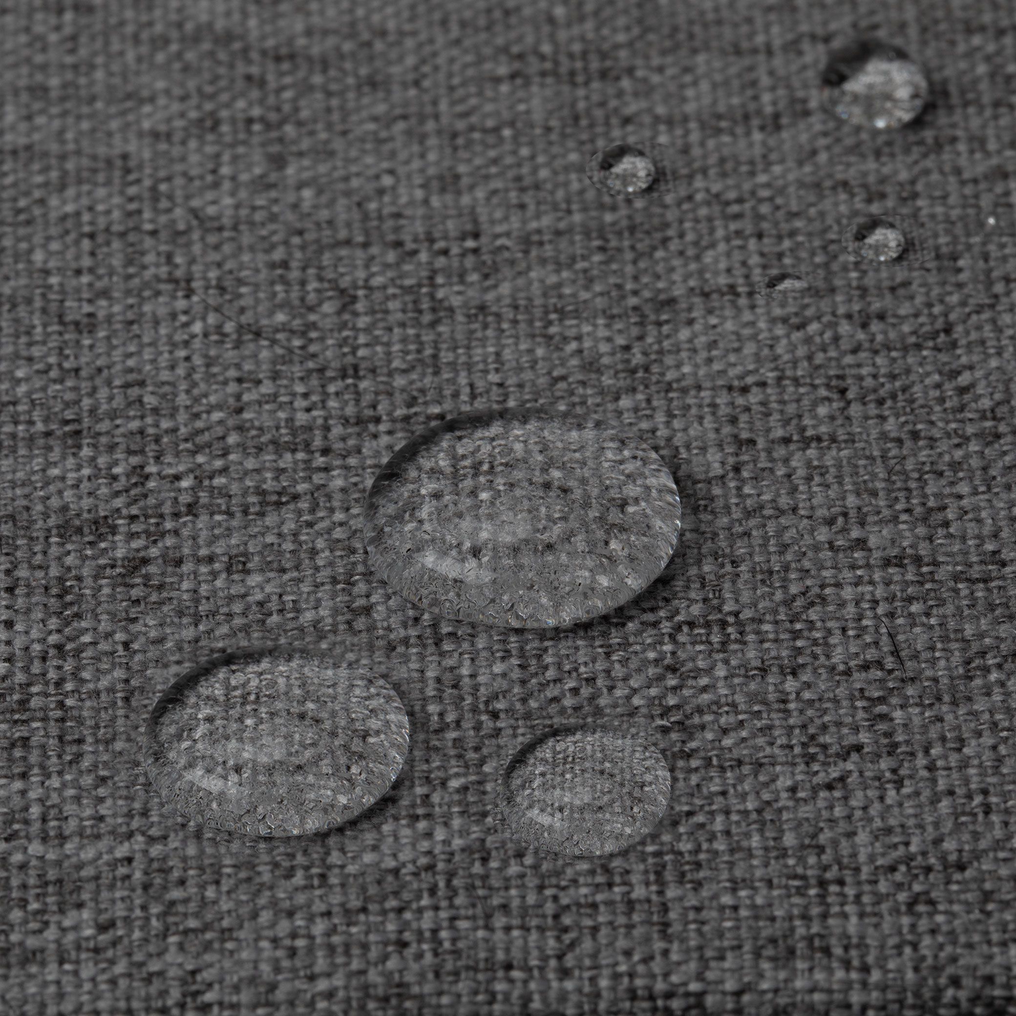 Close-up of Bolstr Dog Bed outer cover repelling water droplets
