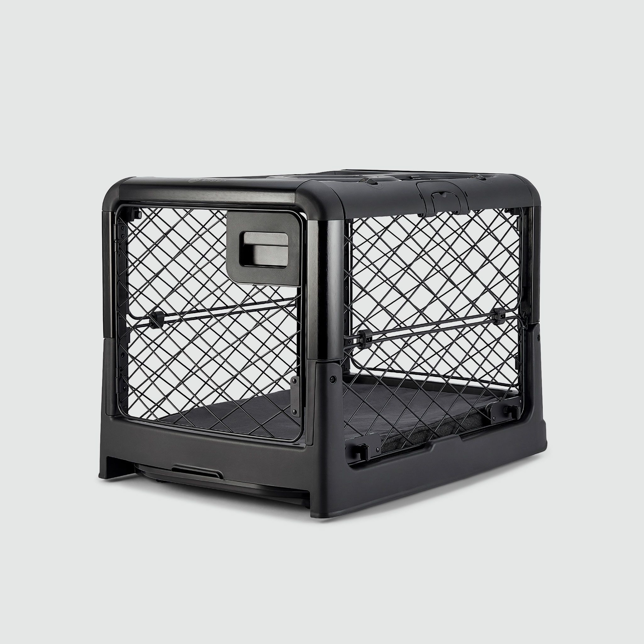 A black dog crate closed on a white background