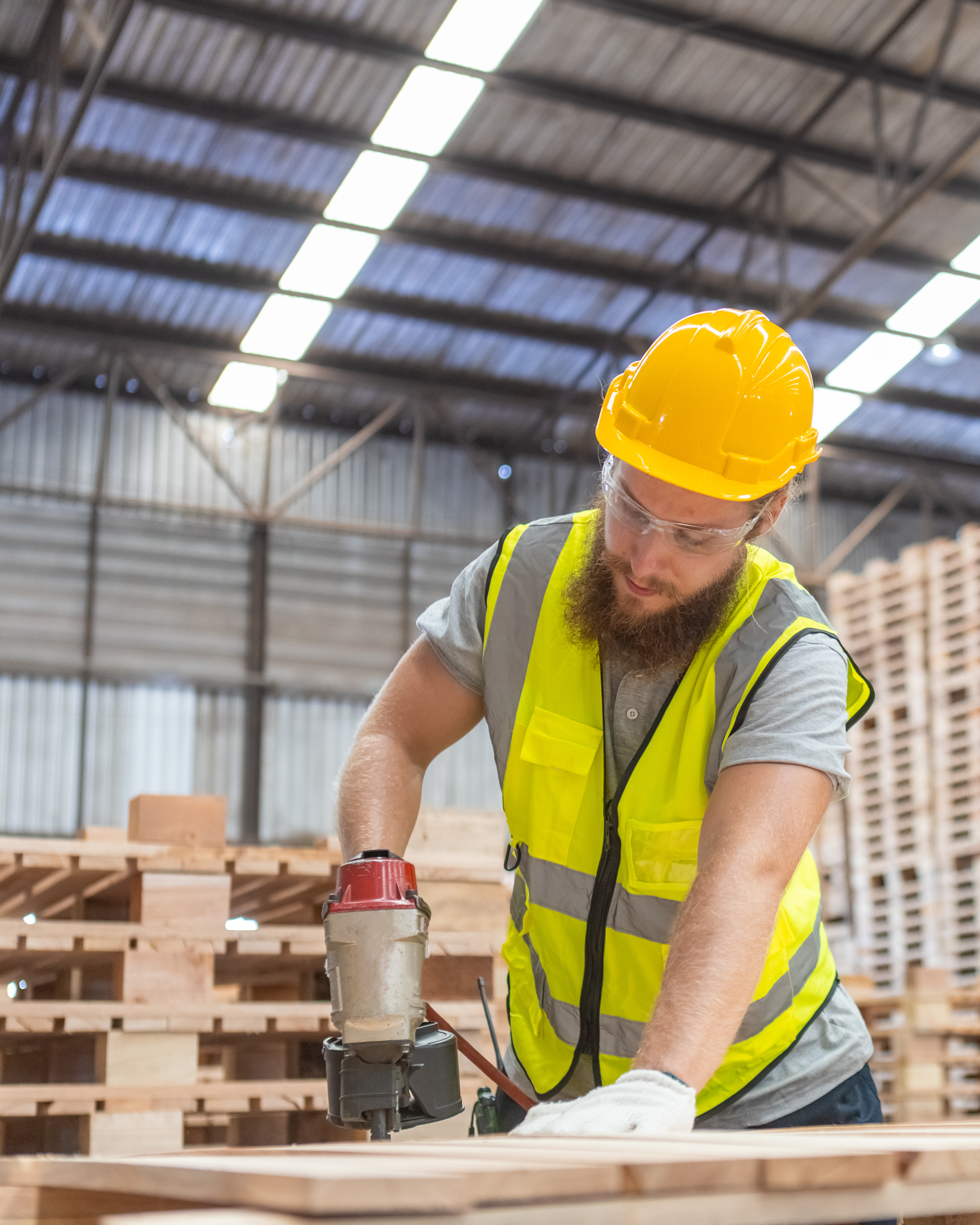 Photo of a man building wood pallets
