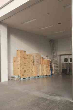 Stacked corrugated cardboard boxes in a warehouse