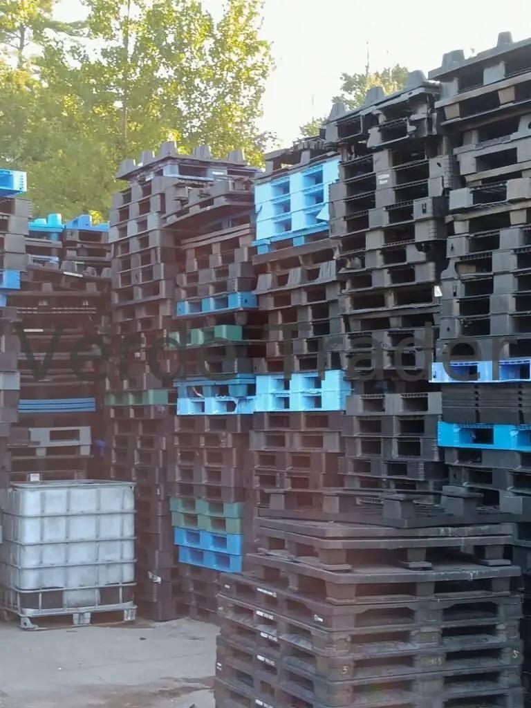 Nestable plastic pallets stacked inside each other