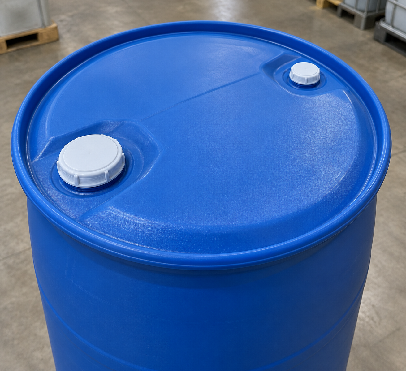 Top of a tight head plastic drum with two threaded plugs in the fixed lid