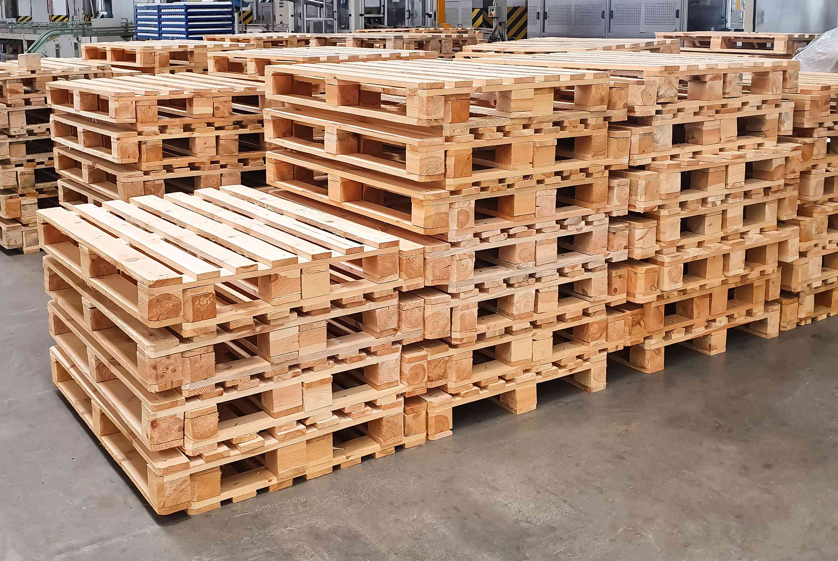A photo of stacks of wood pallets