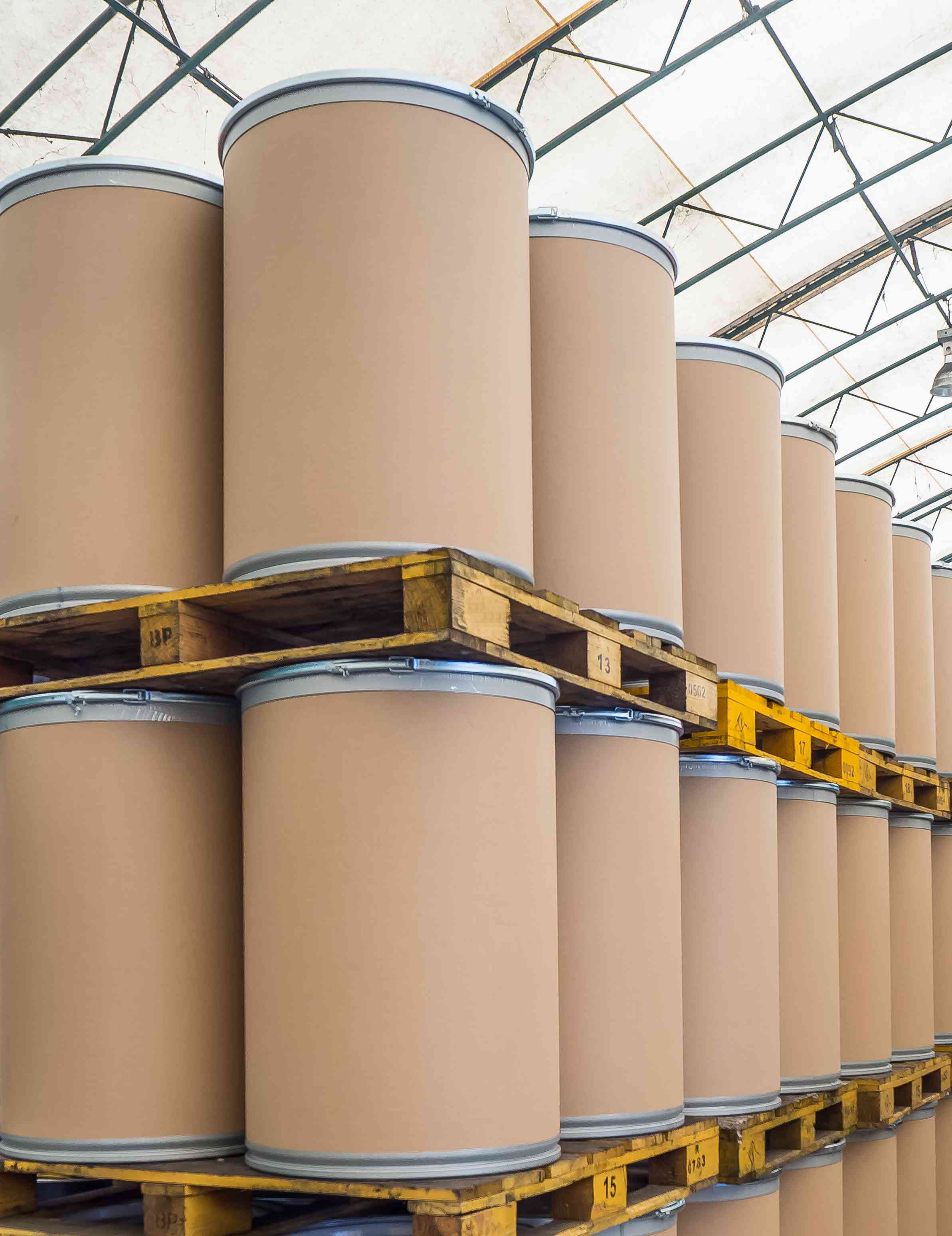 Photo of stacks of fiber drums on pallets