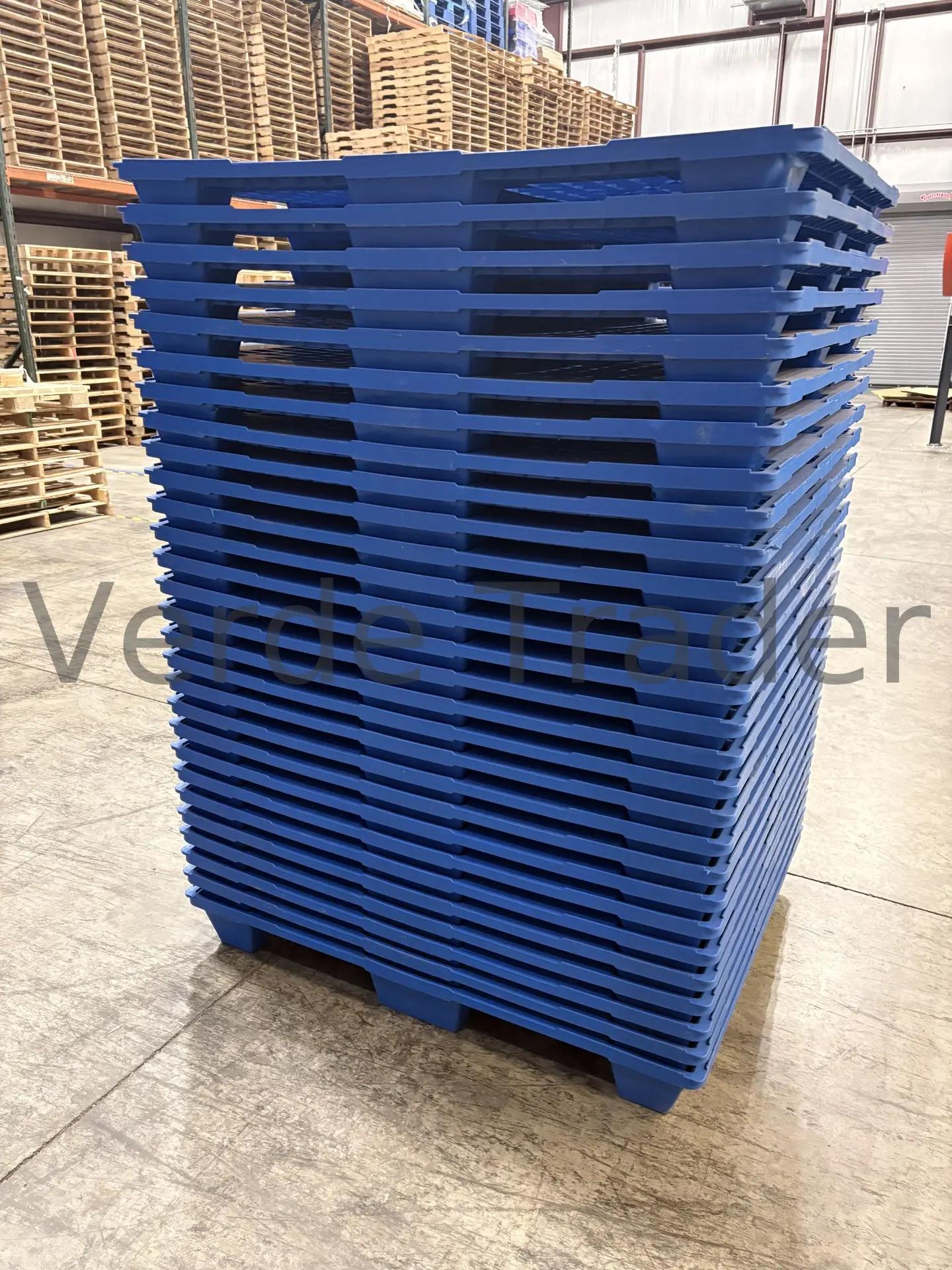 Nestable plastic pallets stacked inside each other