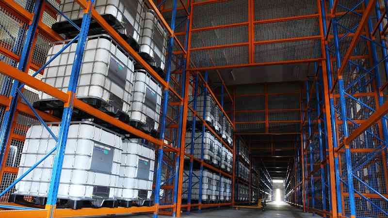 IBC totes on racks in a warehouse