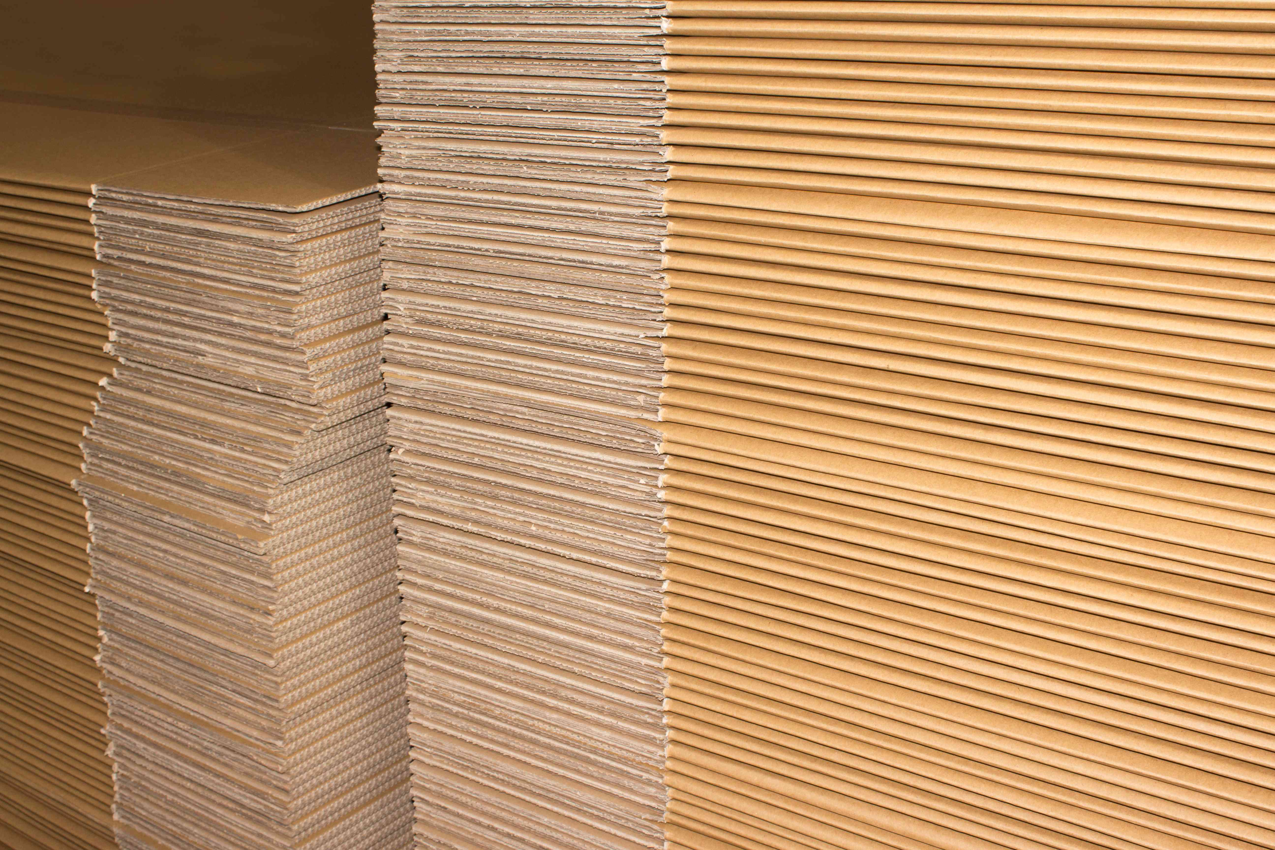Photo of a stack of flattened cardboard boxes