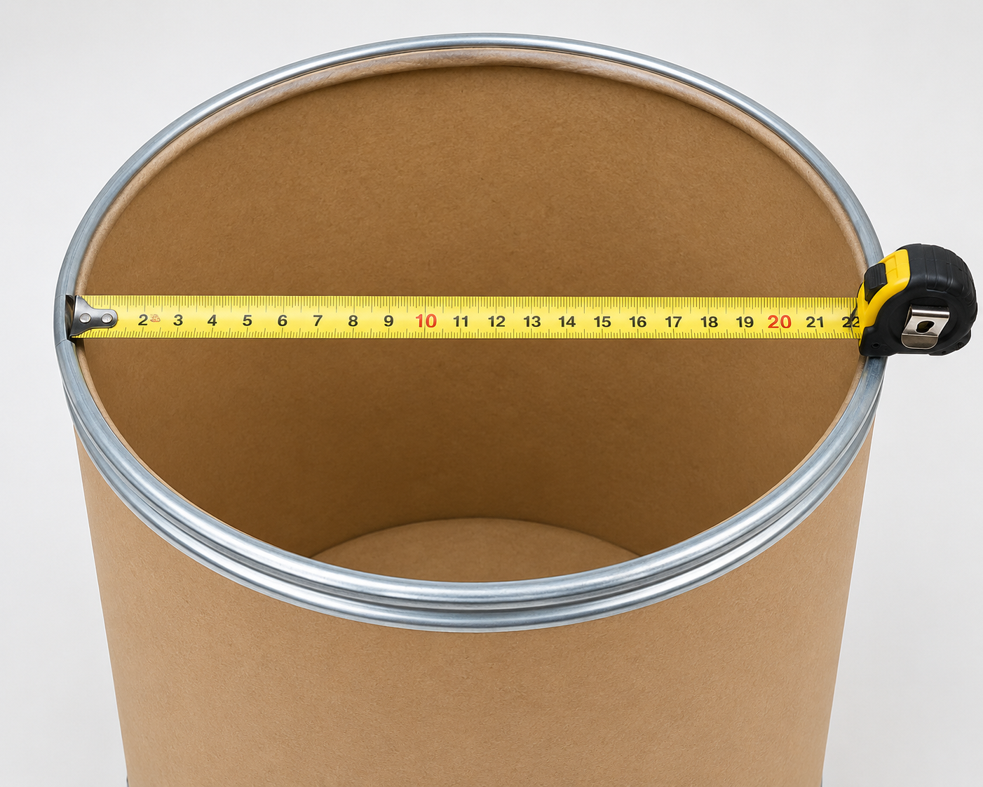 Tape measure stretched across the open top of a fiber drum
