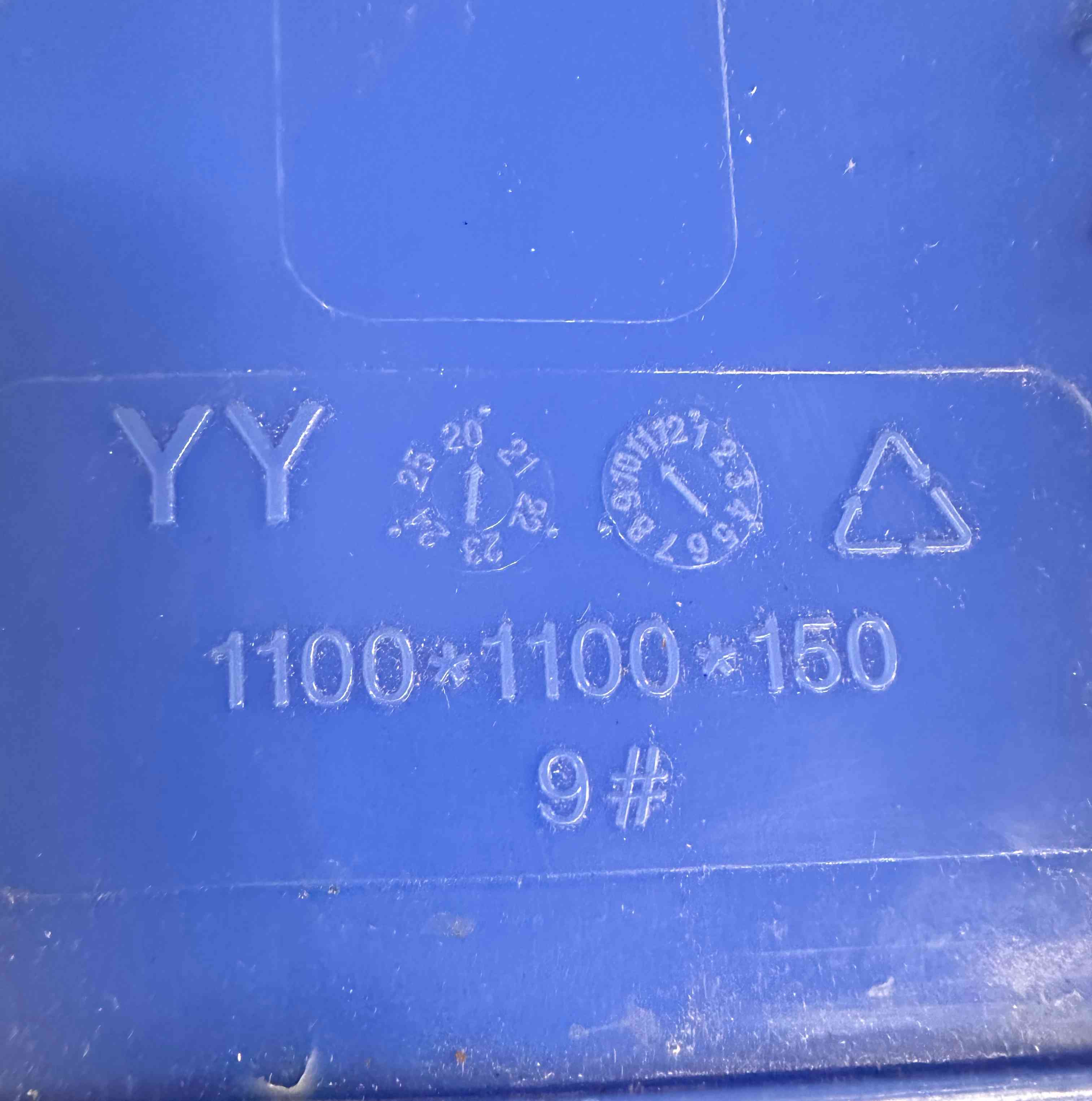 Photo of manufacturer stamps on a plastic pallet