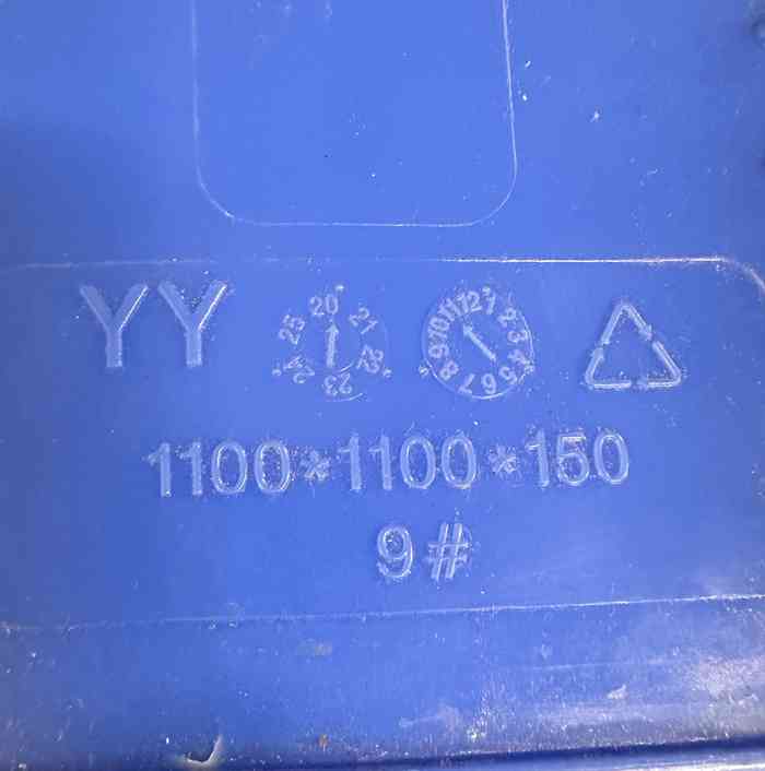 Photo of manufacturer stamps on a plastic pallet