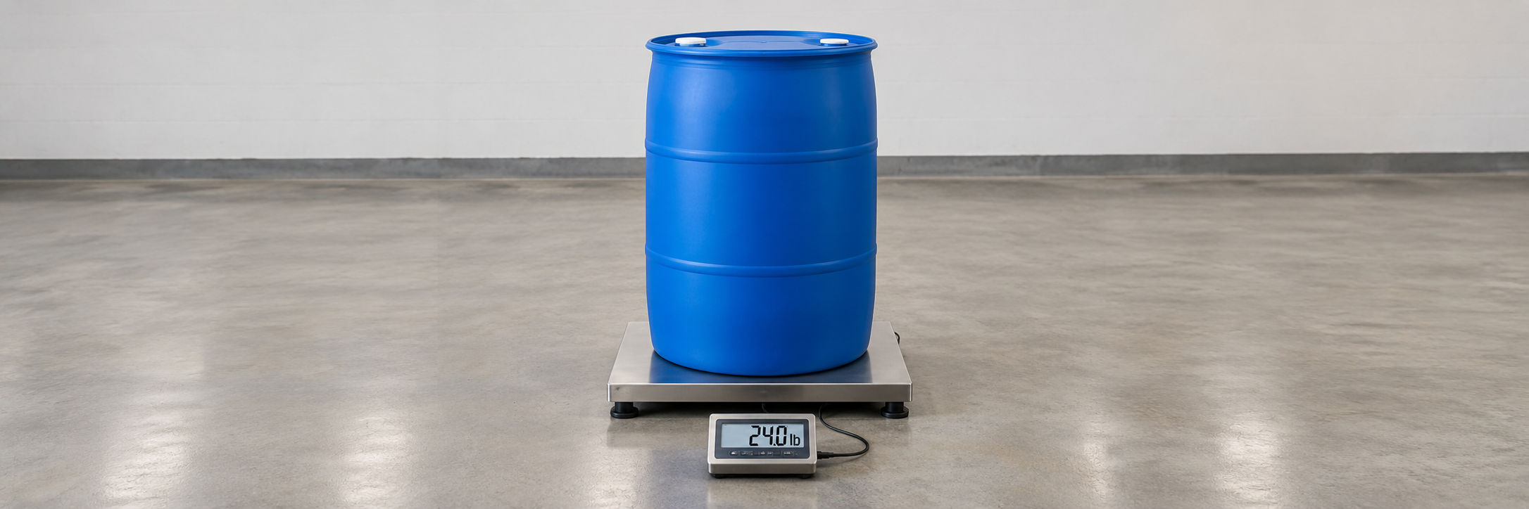 An empty 55 gallon plastic drum standing on a floor scale with the weight display showing