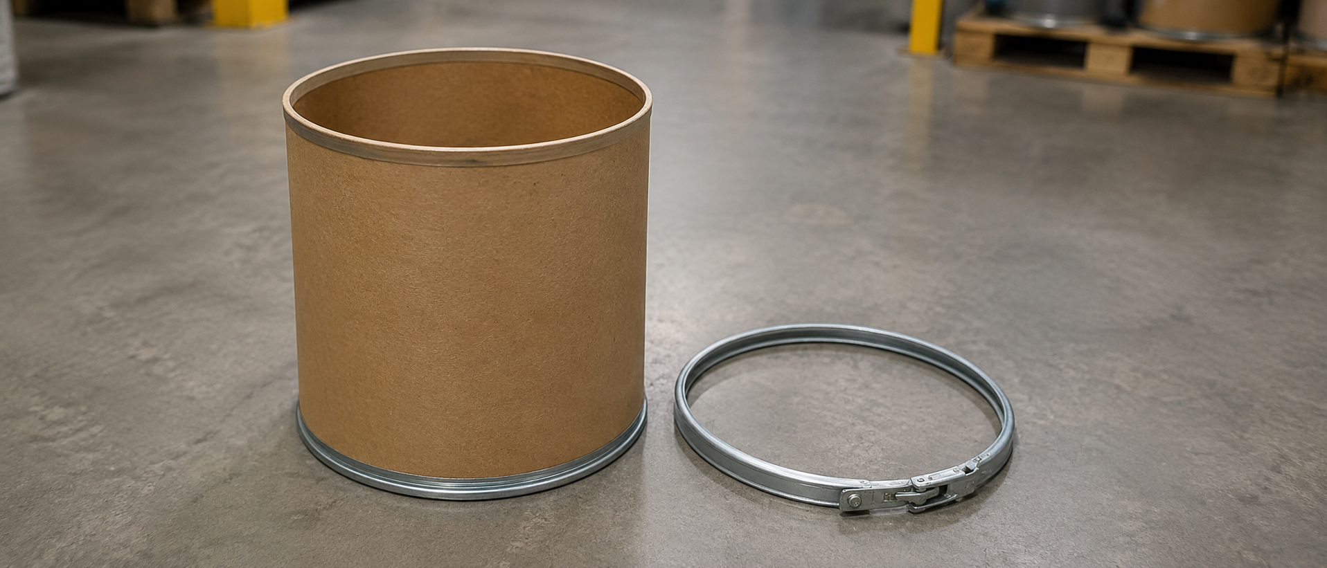 Metal lock ring removed from a fiber drum body, shown separately from the fiber shell
