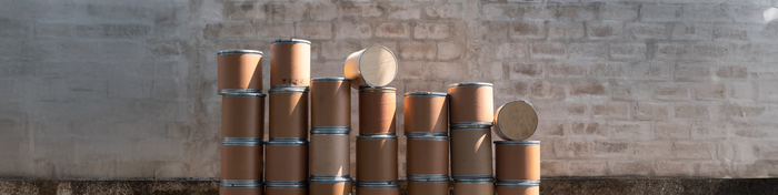 Photo of stacks of fiber drums
