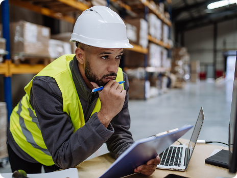 Photo of a warehouse worker at a desk