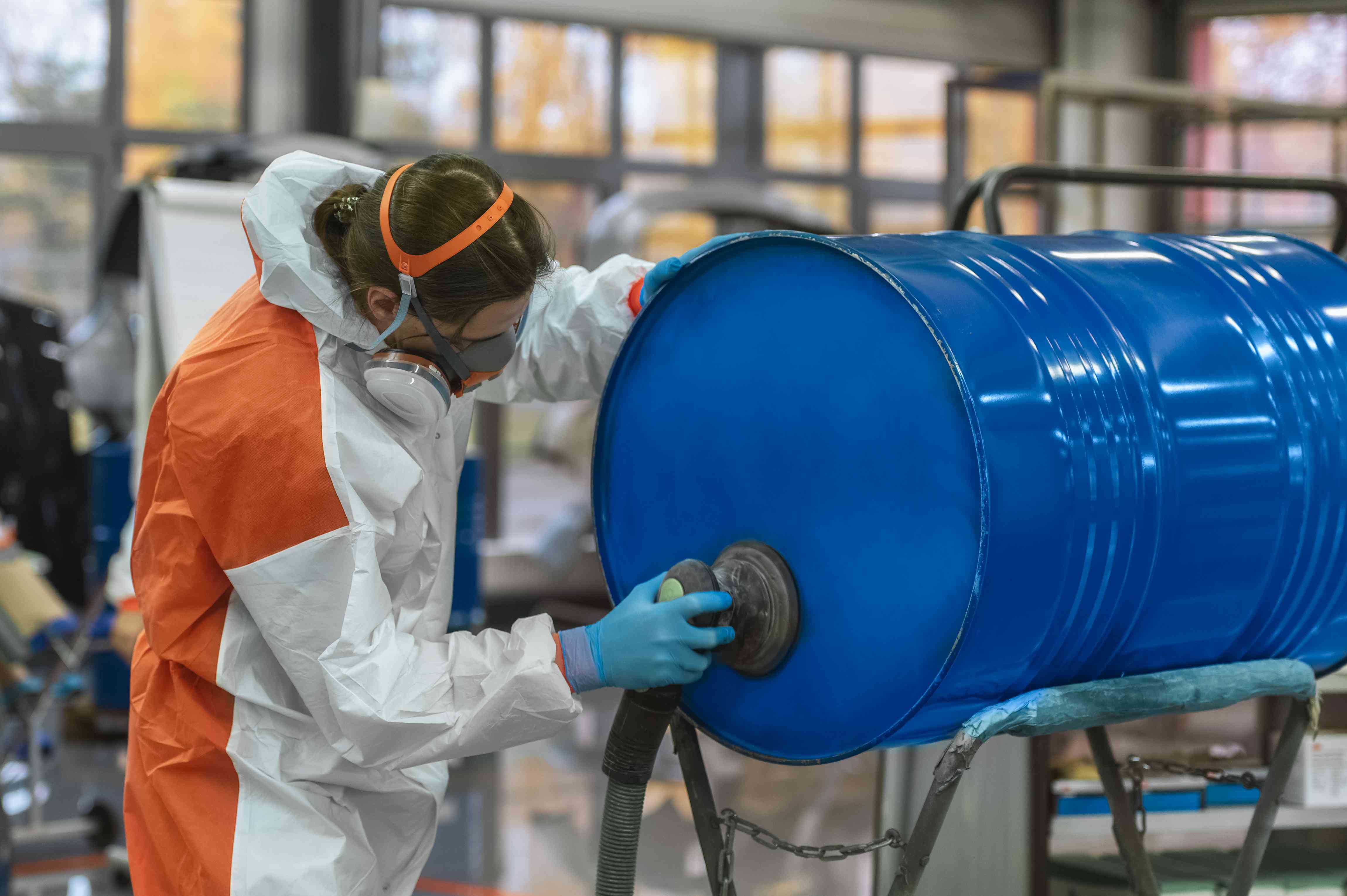 Photo of a person preparing a steel drum