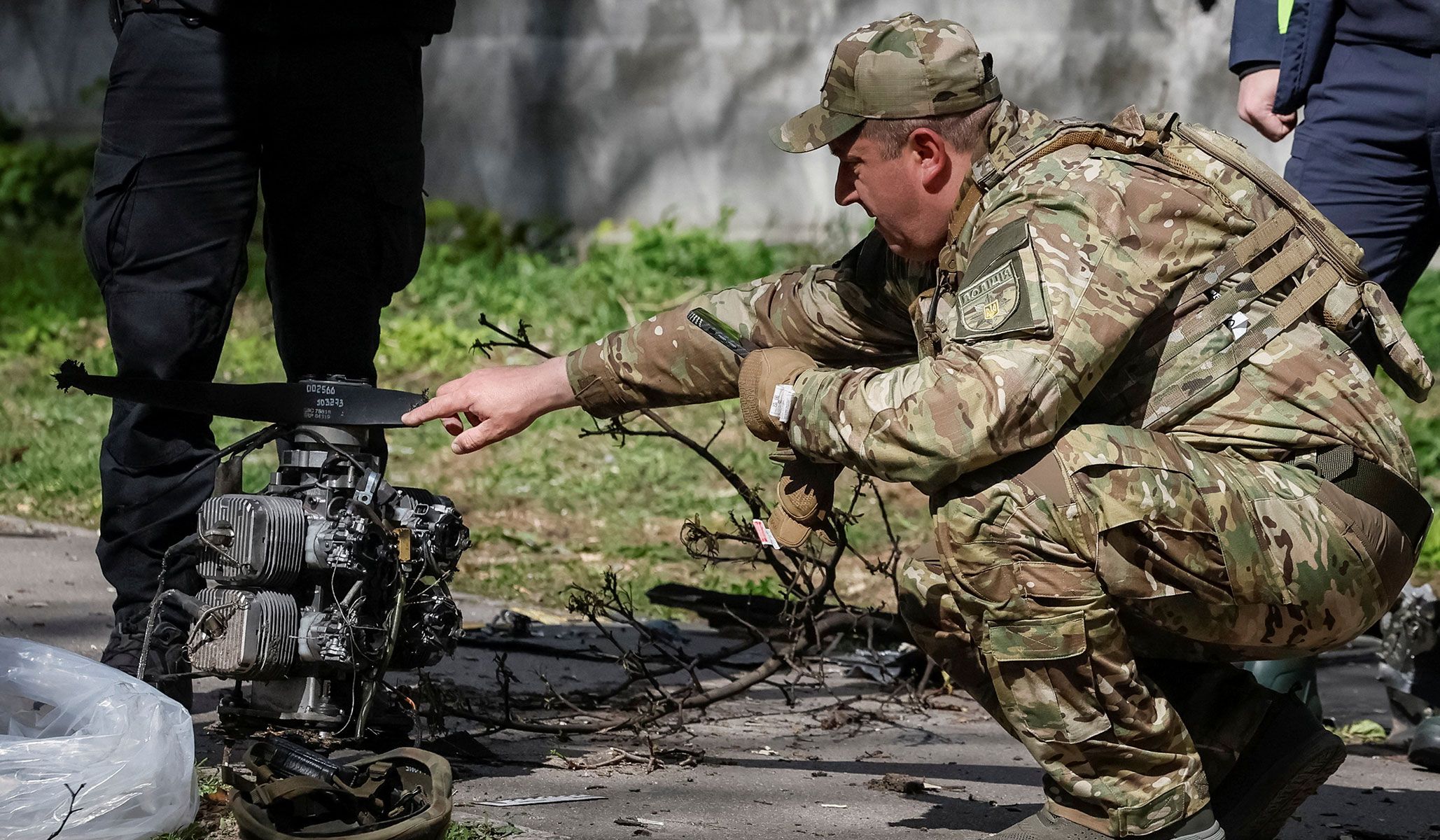 A police expert inspects the engine of a Russian drone at the site of a Russian drone strike in Kyiv, Ukraine, April 28, 2026.