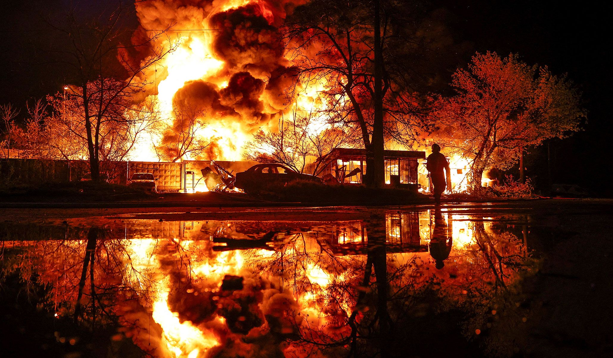 A firefighter works at the site of a recyclable materials warehouse hit by a Russian missile strike in Kyiv, Ukraine, April 16, 2026.
