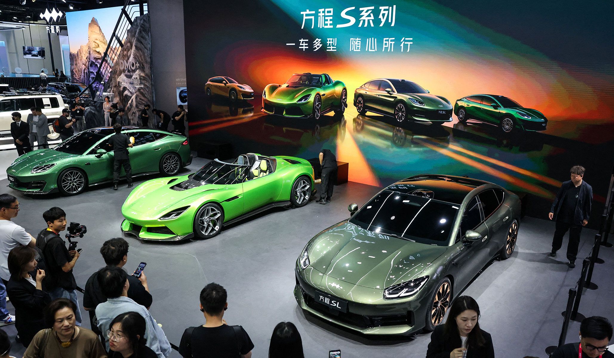 People gather near the newly presented electric cars Formula S, Formula X, and Formula SL of BYD's brand Fang Cheng Bao at the Beijing International Automotive Exhibition in Beijing, China, April 24, 2026.