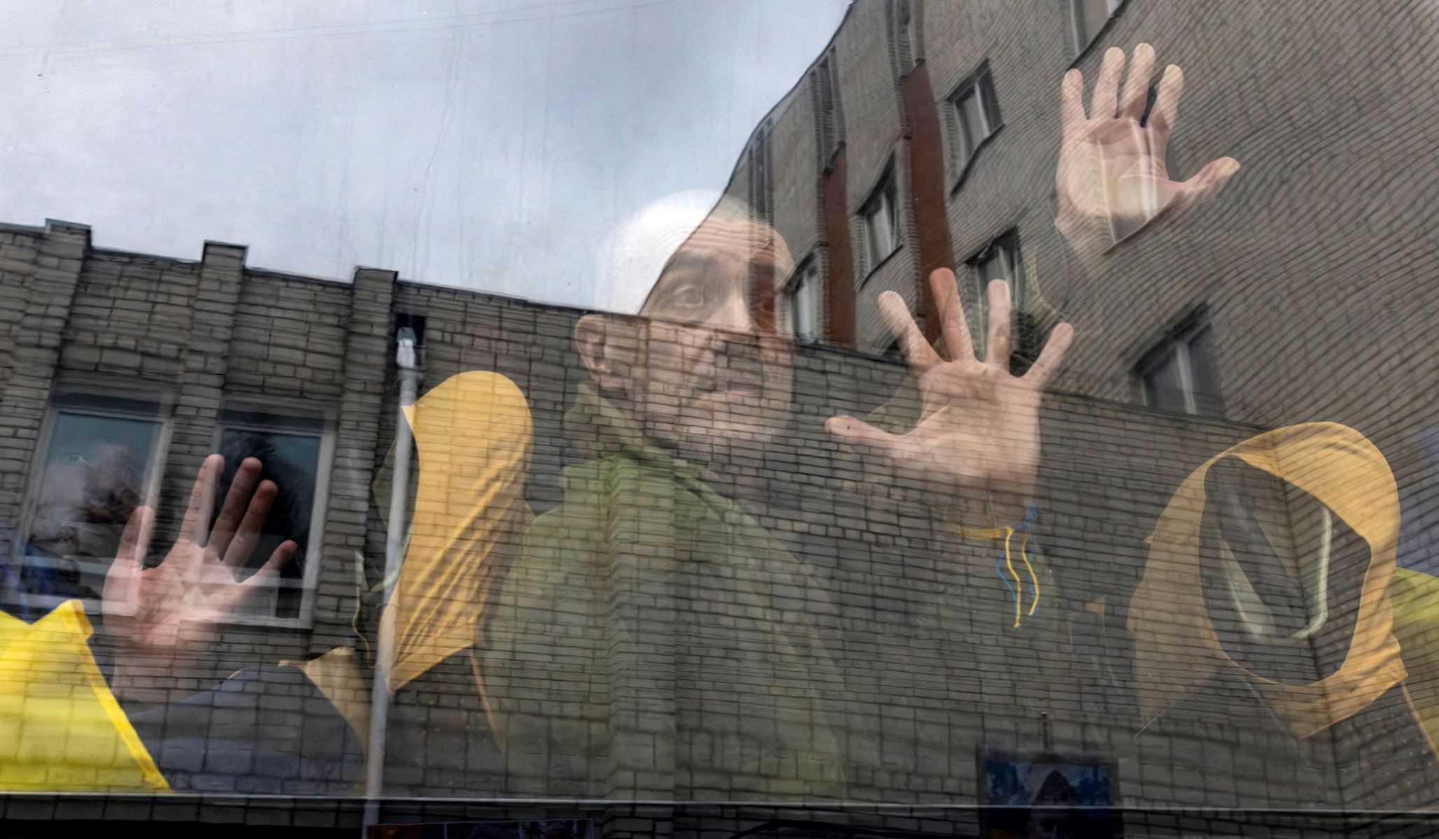 A Ukrainian soldier waves from a bus after a prisoner of war swap in an undisclosed location in Ukraine, April 11, 2026.